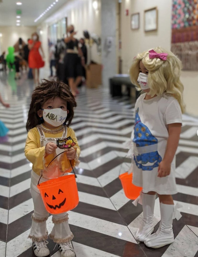 kids dressed in ABBA costumes for Halloween with wigs