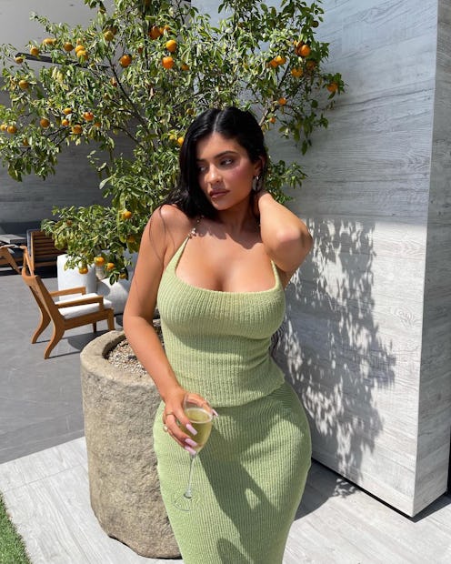 Kylie Jenner wears light green knit top and skirt on Instagram on August 10, 2021.