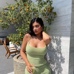 Kylie Jenner wears light green knit top and skirt on Instagram on August 10, 2021.