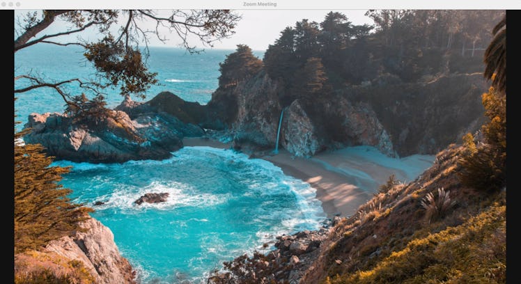 This beach background for Zoom features a cliff by the sea.