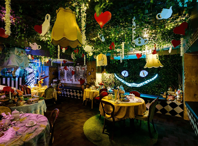 The 'Alice in Wonderland' bar in NYC has immersive experiences and a Cheshire Cat wall.