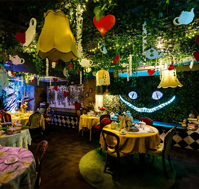 The 'Alice in Wonderland' bar in NYC has immersive experiences and a Cheshire Cat wall.