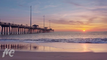 This beach background for Zoom shows a sunset view over Jennette's Pier in Nags Head, North Carolina...