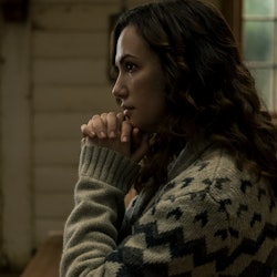 KATE SIEGEL as ERIN GREENE in episode 101 of MIDNIGHT MASS. She is kneeling in a church pew.