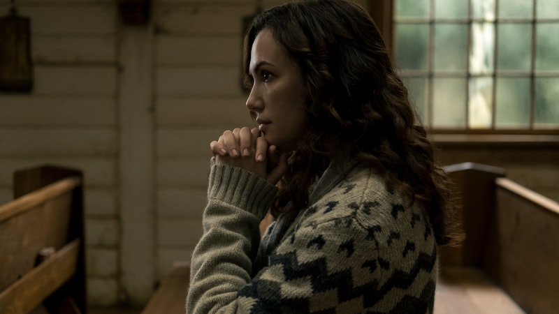 KATE SIEGEL as ERIN GREENE in episode 101 of MIDNIGHT MASS. She is kneeling in a church pew.