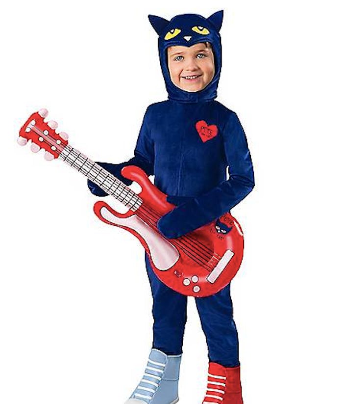 Boy wearing a Pete the Cat Halloween costume holding a fake guitar