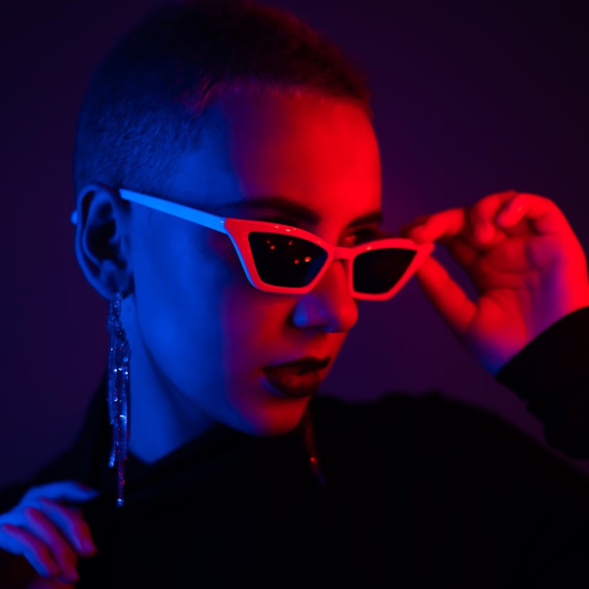 Woman wearing sunglasses during Mercury retrograde fall 2021.