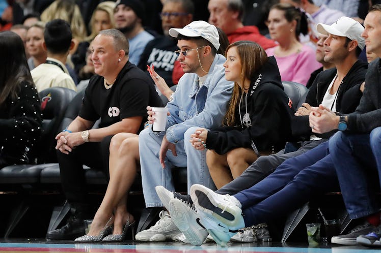 Music artist Bad Bunny looks on during the first half between the Miami Heat and the Dallas Maverick...