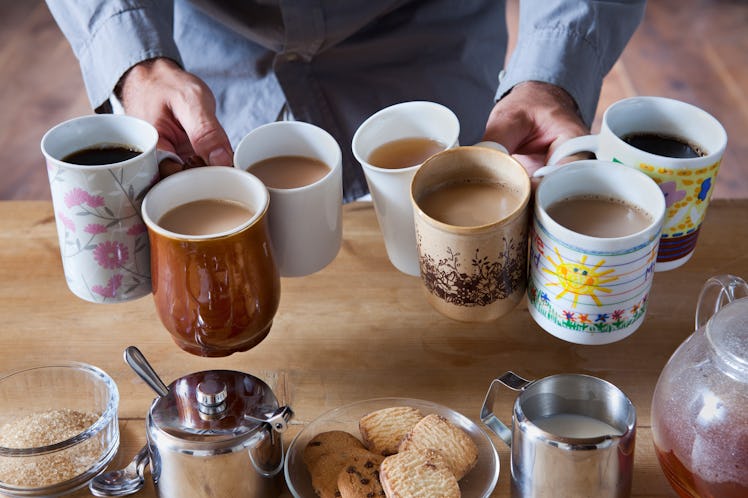 https://www.gettyimages.com/detail/photo/man-holding-many-tea-and-coffee-cups-royalty-free-image/112...