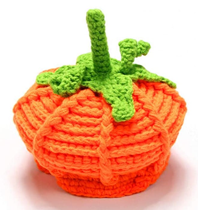 Image of an orange baby wool hat with green "stem."