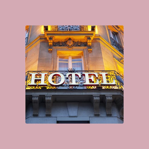 The front entrance of a hotel with "HOTEL" written on it