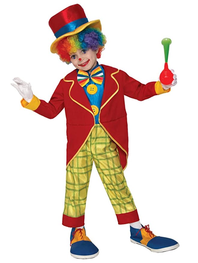 Young boy dressed as clown