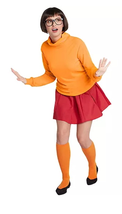 Adult woman dressed as Velma from Scooby Doo