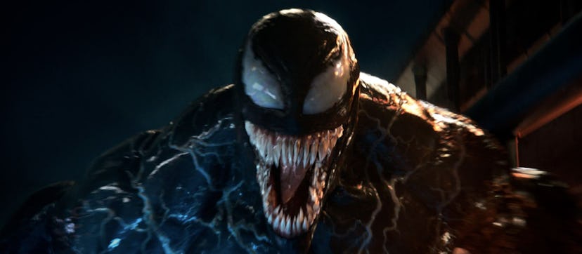 A still from the movie 'Venom' with Venom opening his mouth in a snarl to show his rows of teeth. 