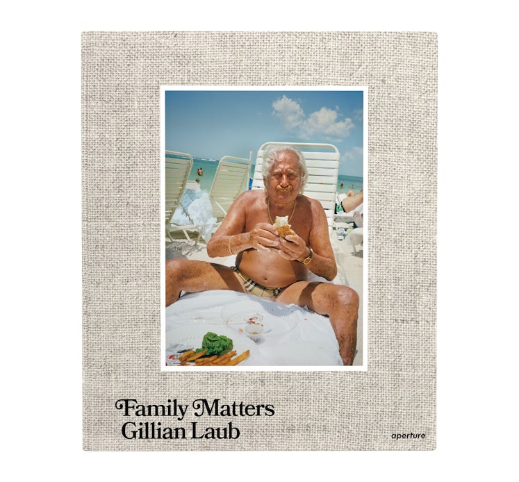 The cover of Family Matters by Gillian Laub with an older man eating a sandwich at the beach 