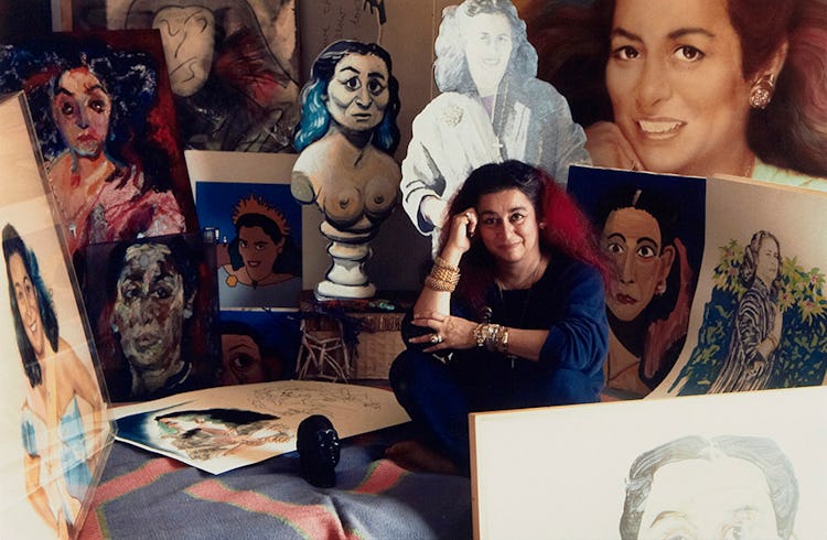 Quinn in the late 1980s, surrounded by a few of the portraits  of her.
