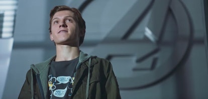 A still from 'Spider-Man: Homecoming,' with Peter Parker (Tom Holland) smiling with the Avengers log...
