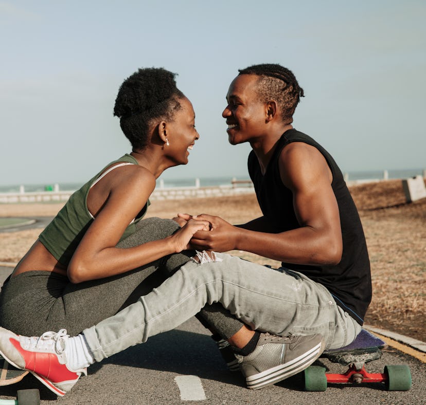 Young skater couple holding hands on October 6, 2021, the most romantic day of the month for every z...