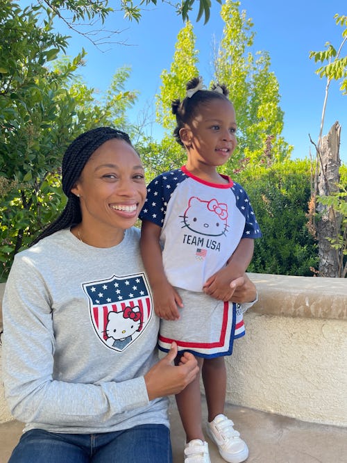 Allyson Felix posing for a photo with her daughter