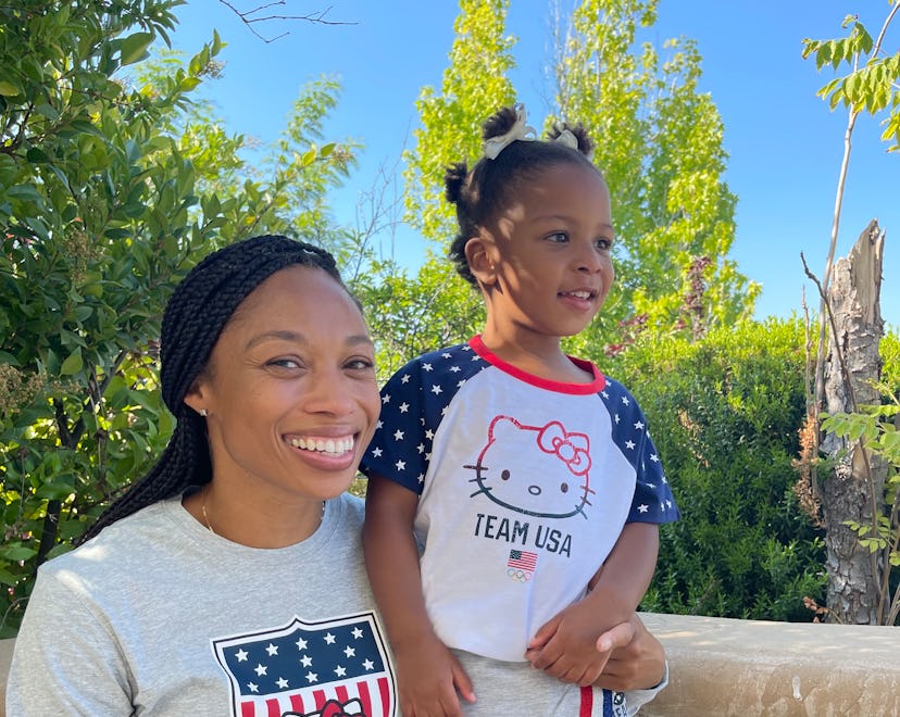 Allyson Felix posing for a photo with her daughter