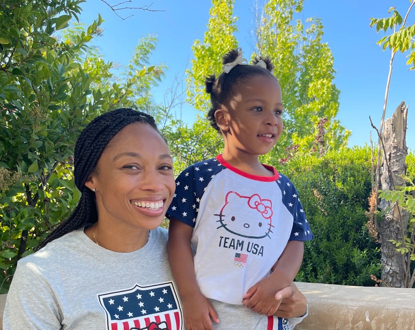 Allyson Felix posing for a photo with her daughter