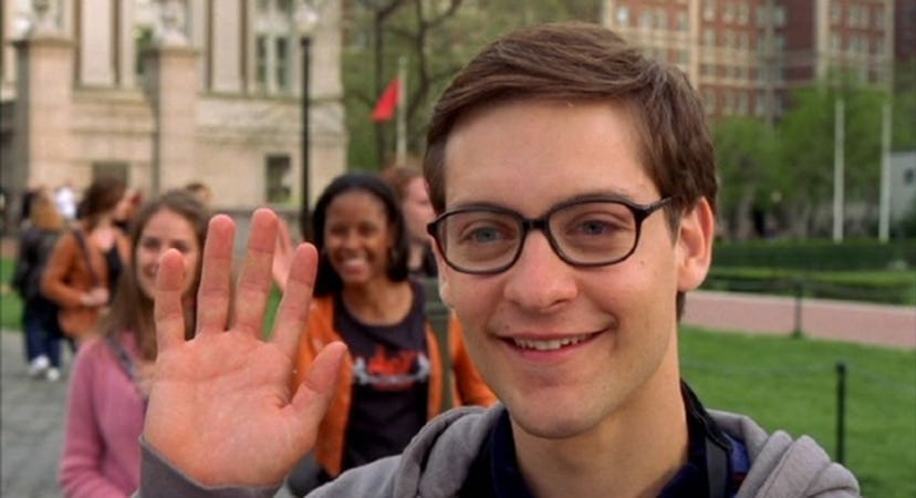 A still from 'Spider-Man' with Peter Parker (Tobey Maguire) in glasses, waving.