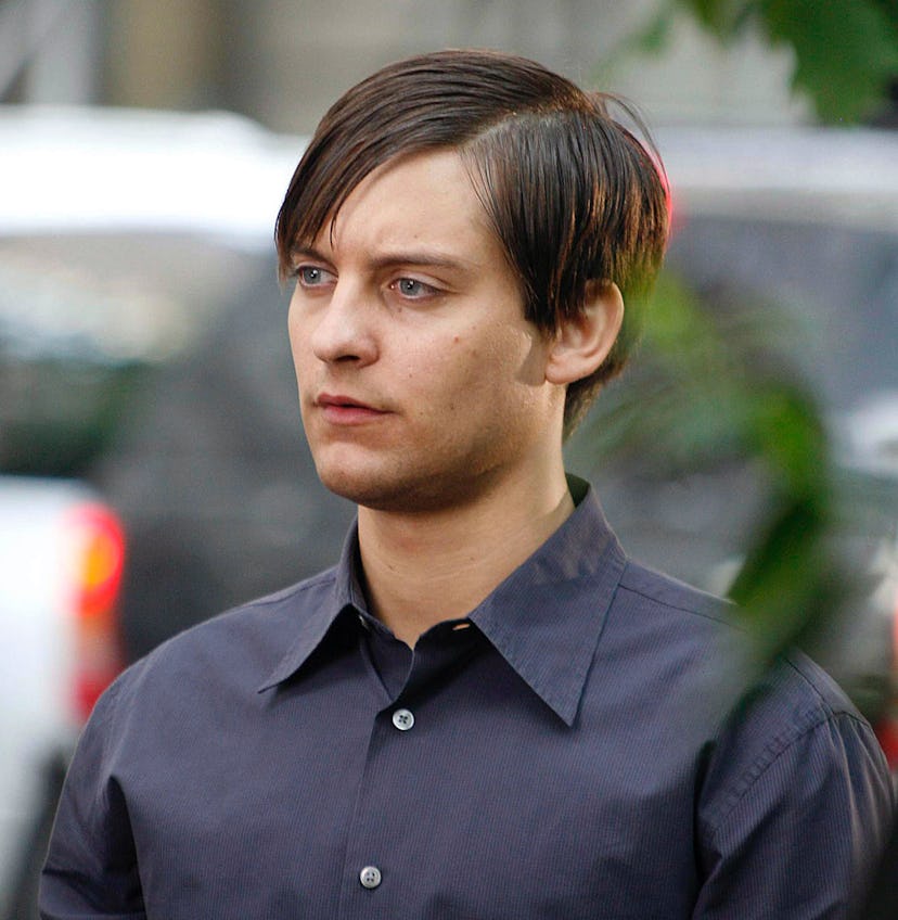 A still of Tobey Maguire on the set of ‘Spider-Man 3,’ with dark hair and a button-down.