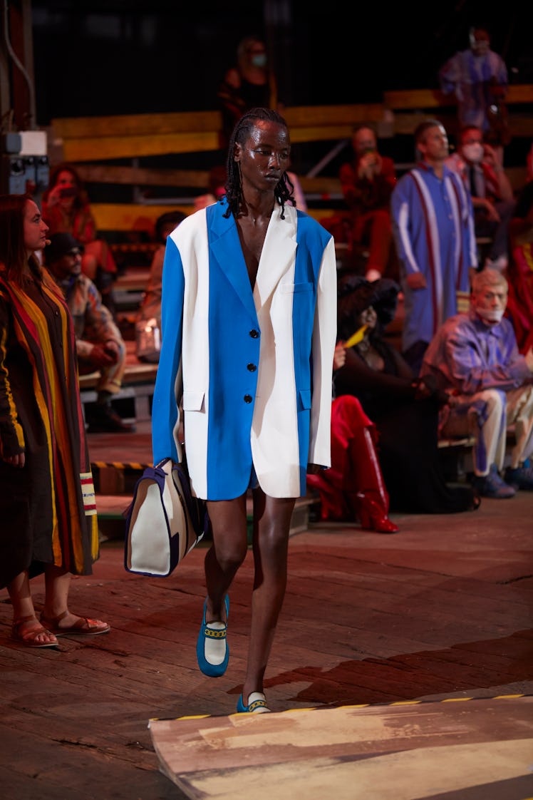 A model walking the runway at Milan Fashion Week Spring 2022 in a Marni oversized blazer in white an...