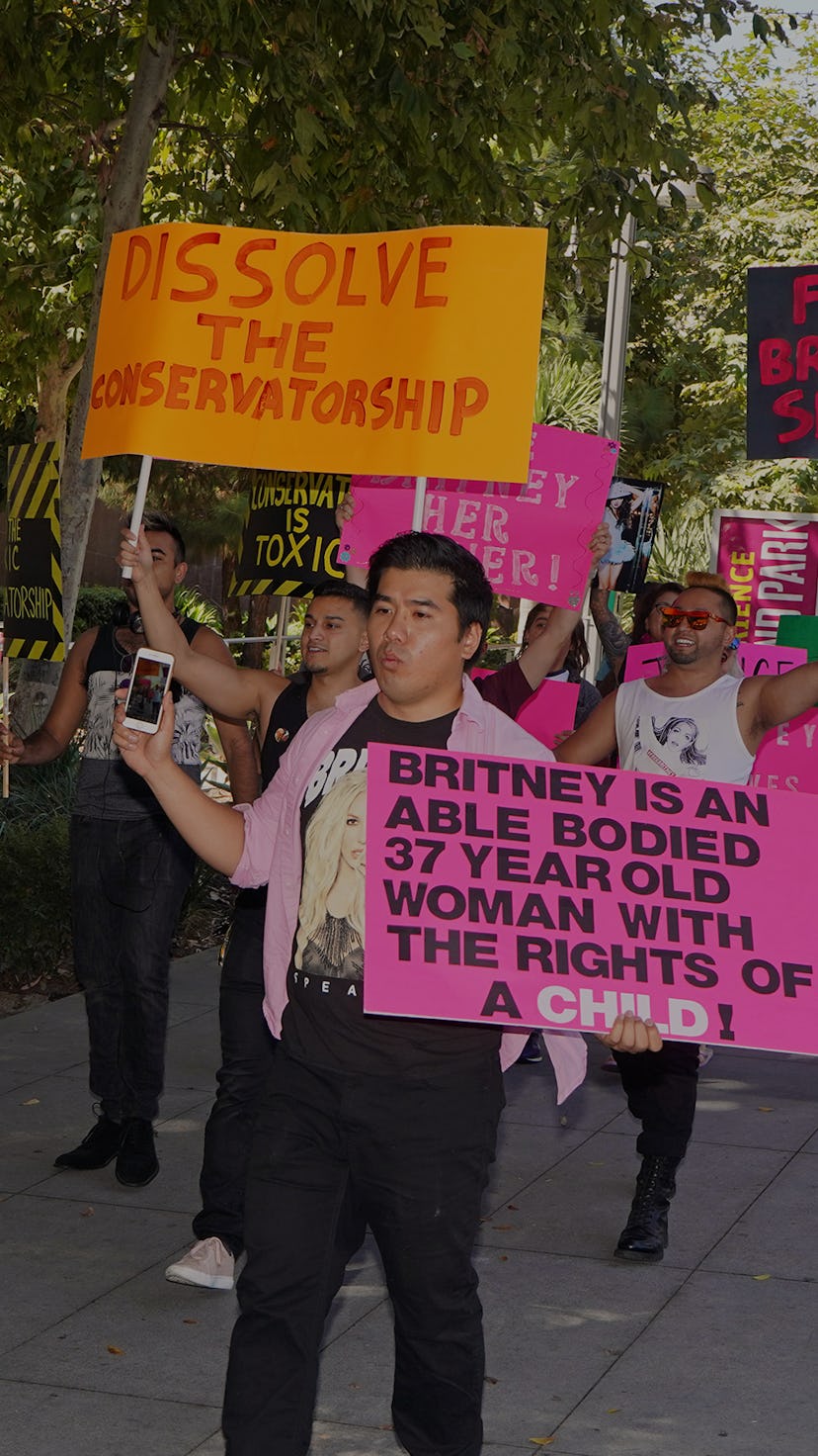 Protestors with #FreeBritney banners, marching through the streets.