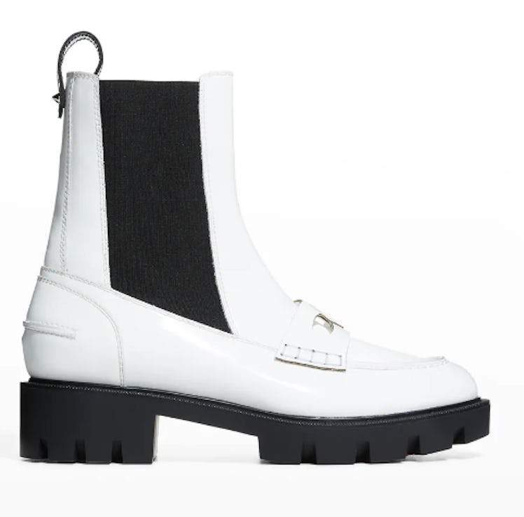 Christian Louboutin's white chelsea loafer boots. 