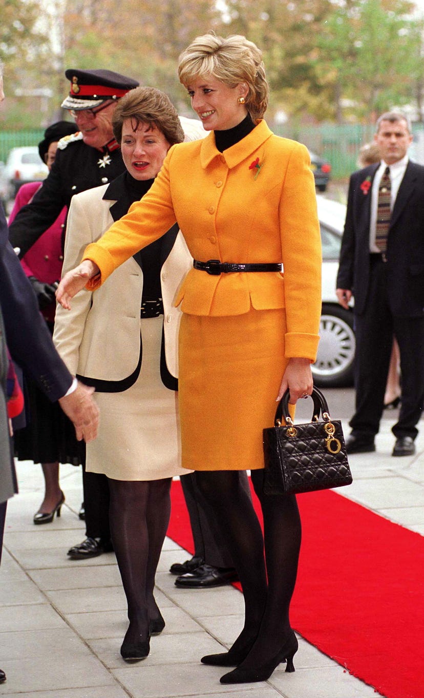 Princess Diana Visiting Liverpool. Diana Is Wearing A Bright Orange Suit Designed By Versace And She...