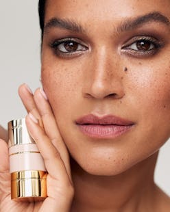 Model holding Westman Atelier eye pods