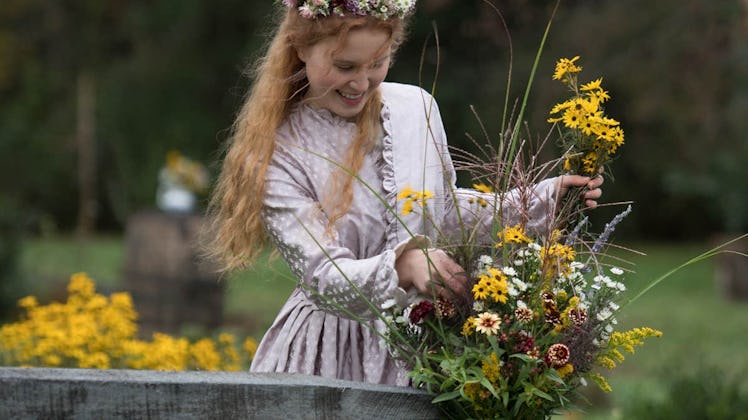 Beth march carries picked flowers in a Little Women scene bursting with cottagecore aesthetic vibes