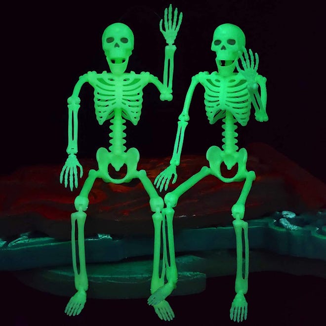 Two glow in the dark skeletons