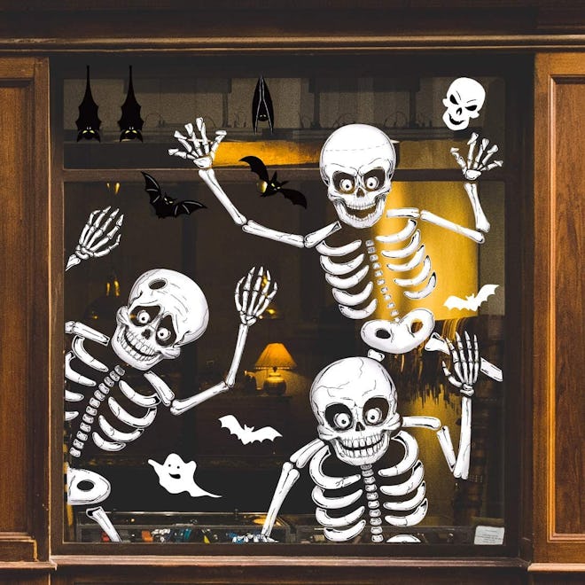 Halloween decorations; three skeleton window clings