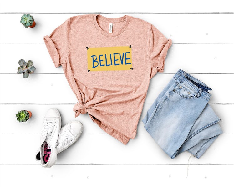 This "Believe" shirt is part of the many 'Ted Lasso' shirts on Etsy that fans should check out. 
