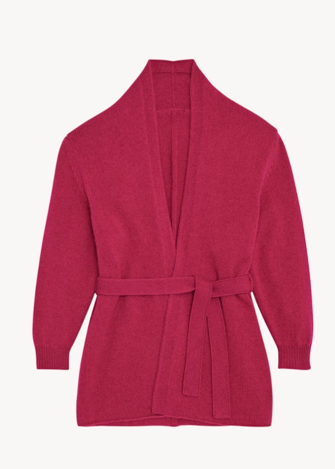 Flay lay of a fuchsia belted cardigan 