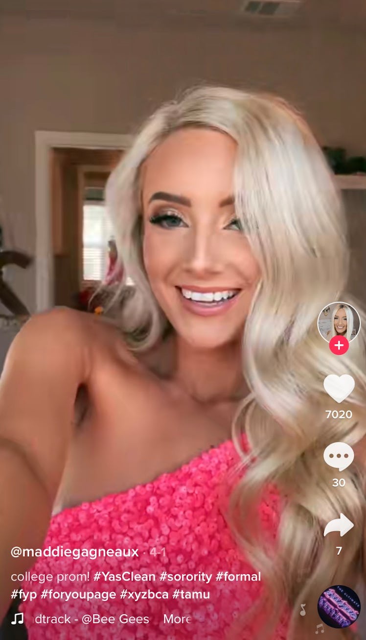 A sorority girl shows off her sorority formal outfit in a TikTok reveal video, which is a great idea...