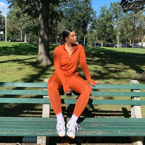 Influencer and YouTuber Tyla Lauren wears terra cota All Access Unison ¼ Zip and Center Stage Leggin...