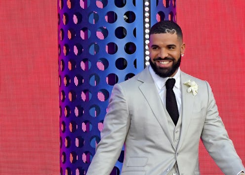 Drake accepts Artist of the Decade with son Adonis on stage during the 2021 Billboard Music Awards.