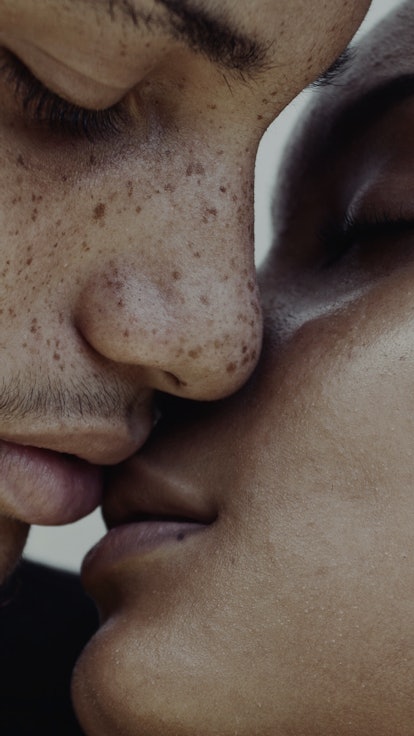 Two people kissing. 
