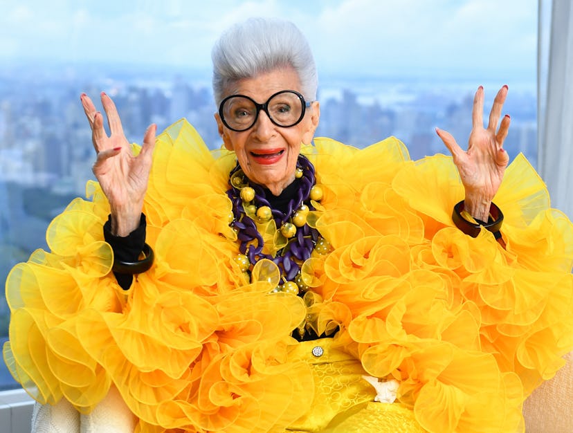 Iris Apfel wearing a dramatic yellow look