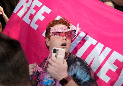 Youtuber Jakeyonce with pink glasses and a support banner during the judge's decision in Britney Spe...