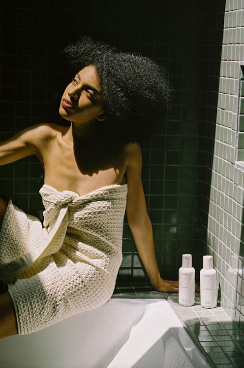 REVERIE model posing in shower
