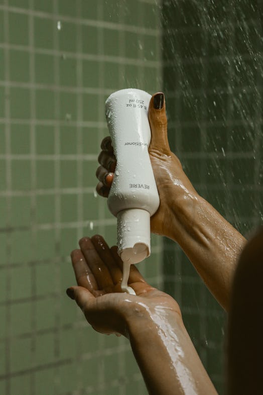 REVERIE model uses product in shower