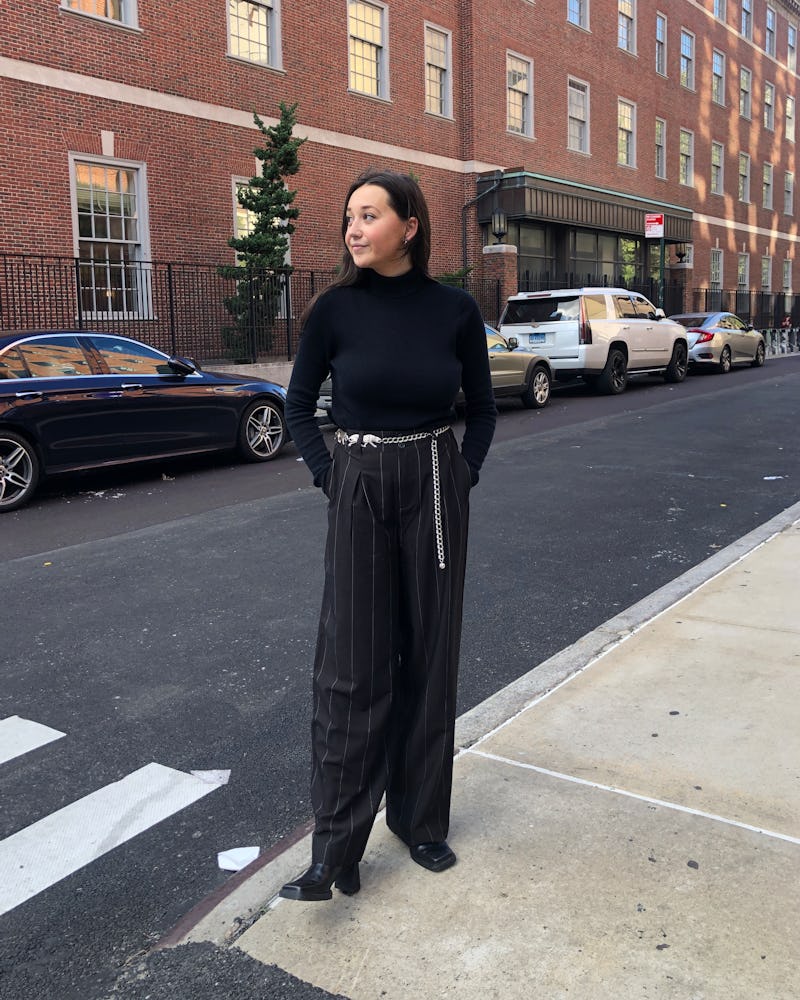 Emma Childs wears a black sweater and pinstripe trouser from Nili Lotan x Target.