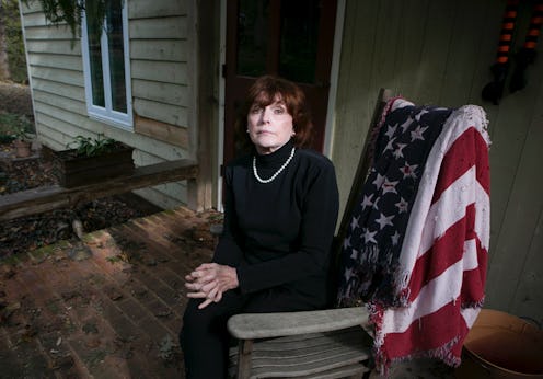Kathleen Willey, 72, sits on the front porch at her home in Powhatan, Va.