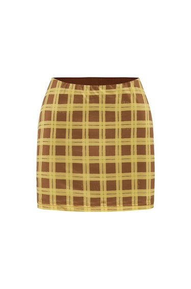 With Jéan Miles mini skirt in checkered Cher print.