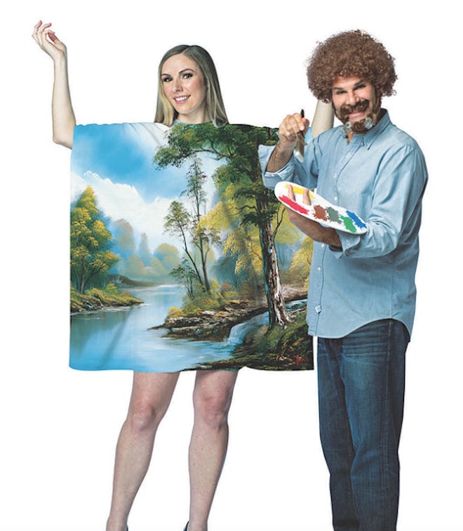 Man dressed as Bob Ross with woman dressed as a painting. 