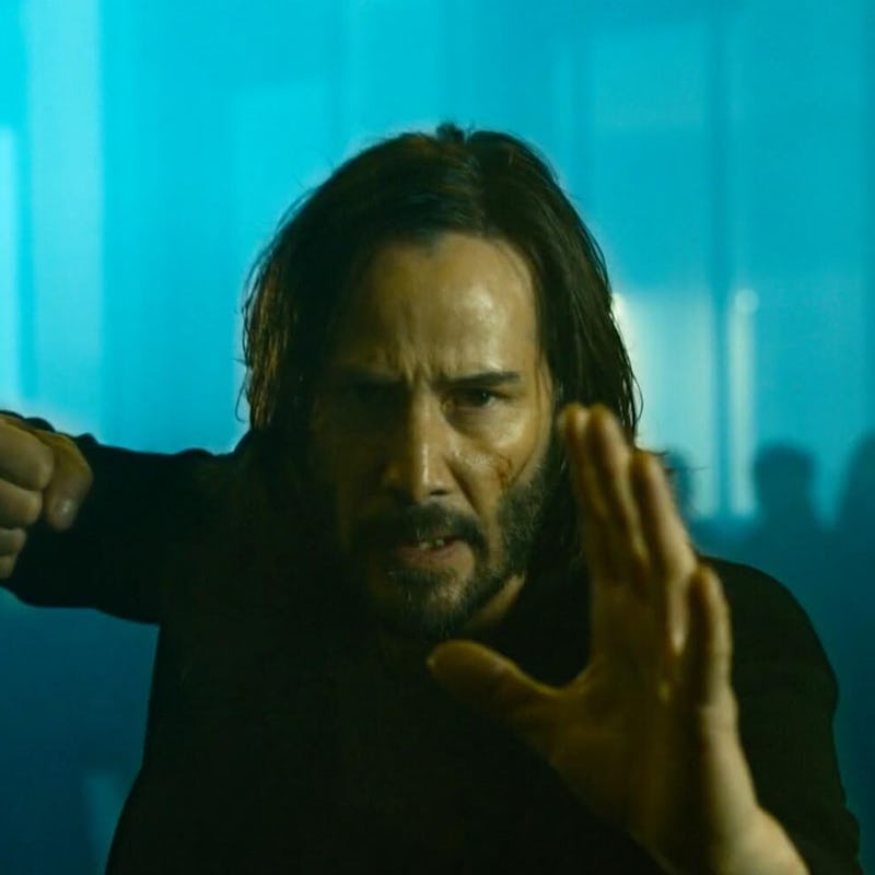 Keanu reeves as Neo from the matrix 4 trailer striking a kung fu pose